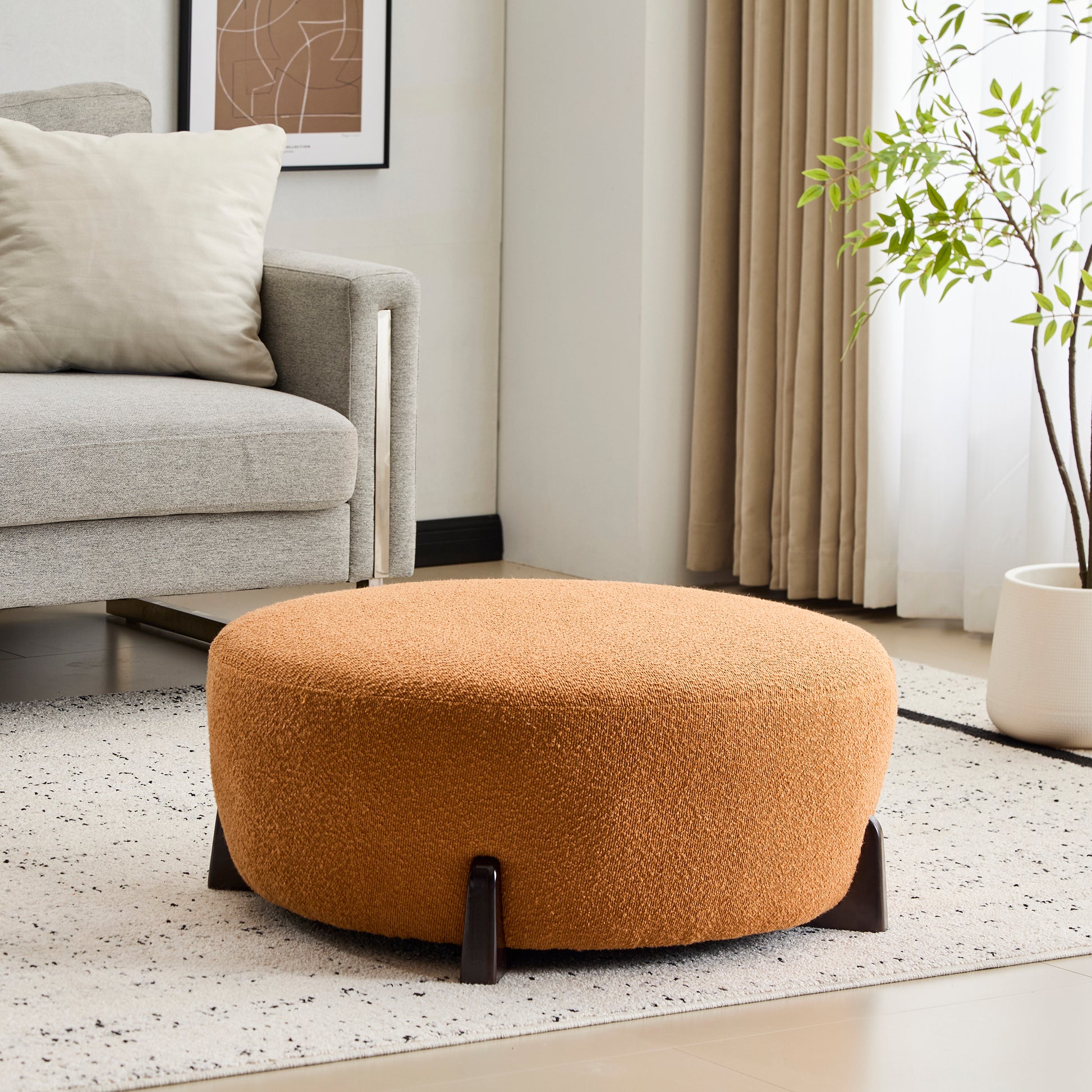Modish Round Ottoman: Boucle Top with Splayed Rubber Wood Legs, Pumpkin Orange image 1