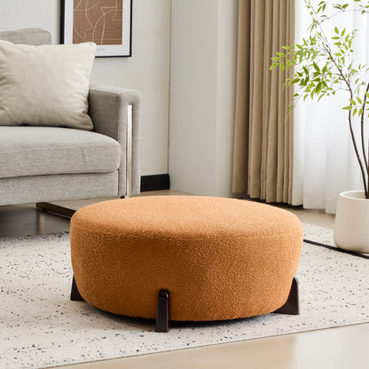 Modish Round Ottoman: Boucle Top with Splayed Rubber Wood Legs, Pumpkin Orange image 1
