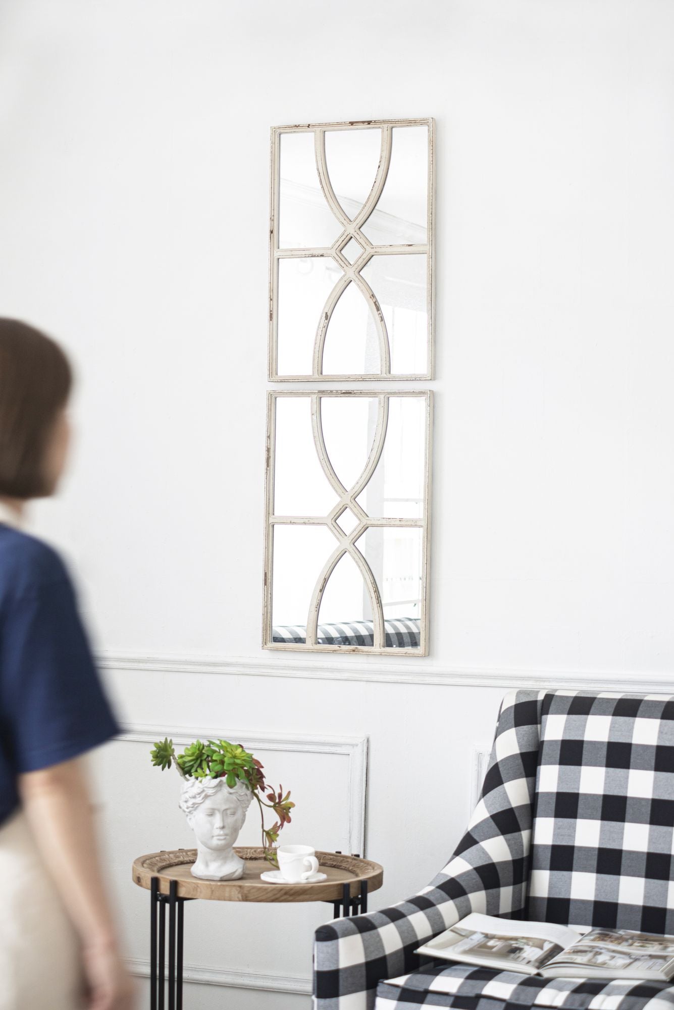 Two wooden wall mirrors displayed side by side horizontally