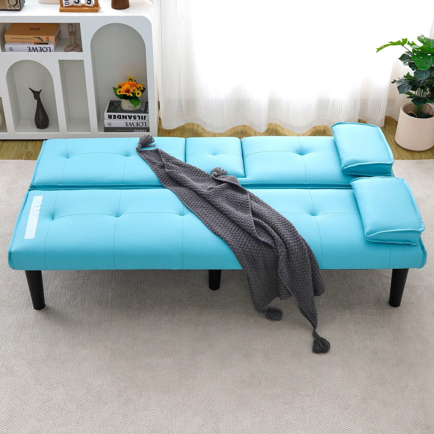 The 67-inch blue PVC multi-functional sofa bed, with a foldable and cup holder design, makes it extremely convenient to turn the living room into a guest room image 1