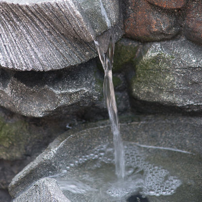 4-tier polyresin cascading rock water fountain with LED light - in garden setting