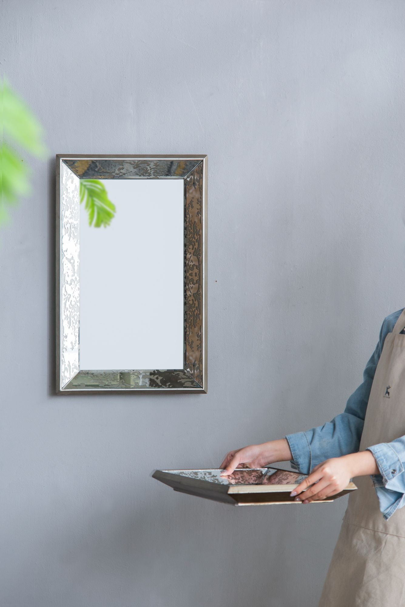 Antique silver mirror in gallery wall setting