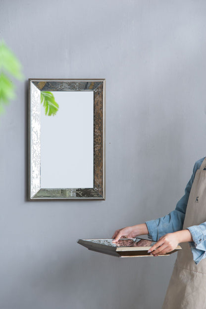 Antique silver mirror in gallery wall setting