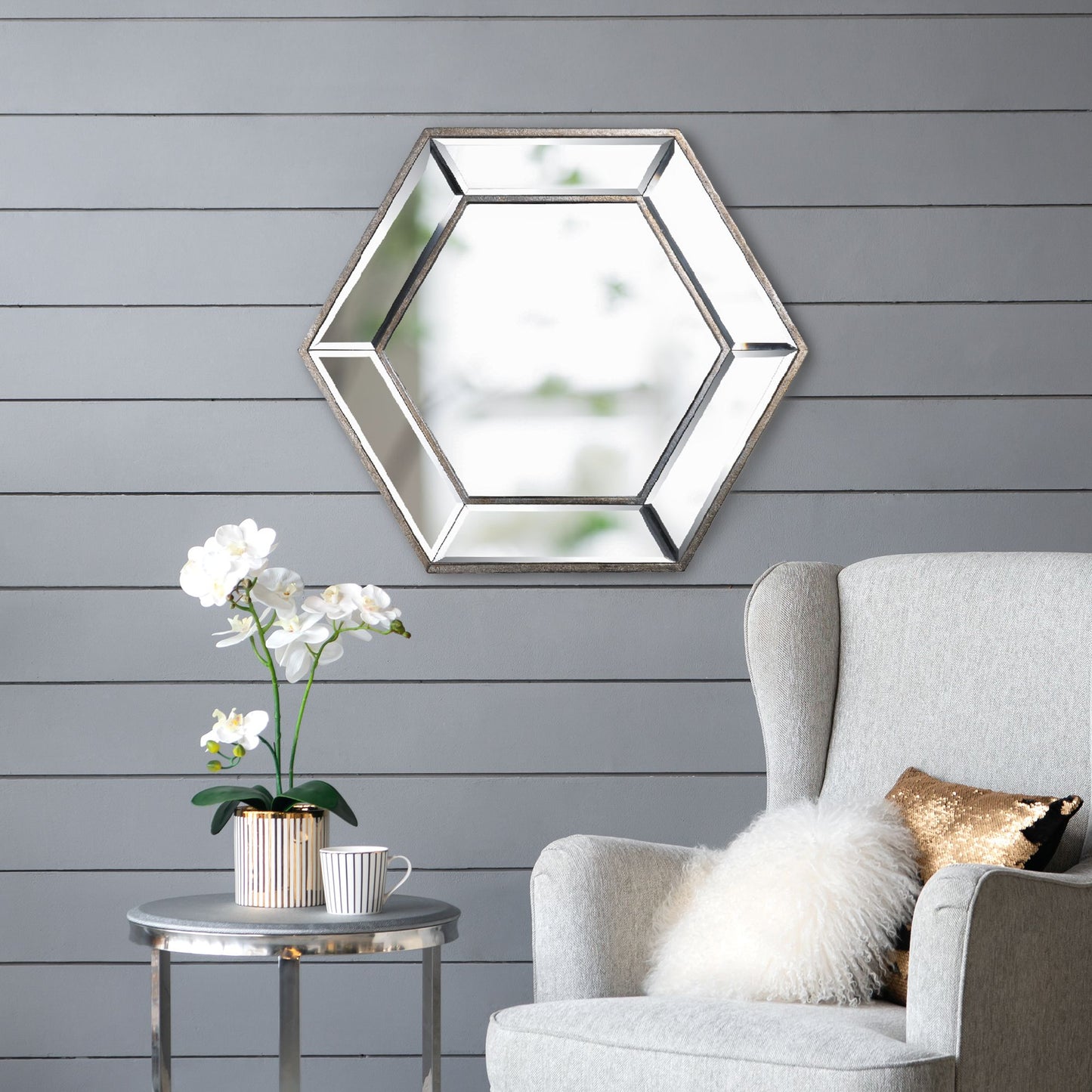 Hexagon accent mirror in bedroom setting