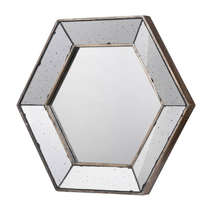 Hexagon accent mirror with traditional silver finish on wall