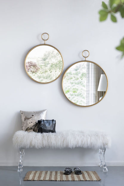 Gold circle wall mirror as home accent piece