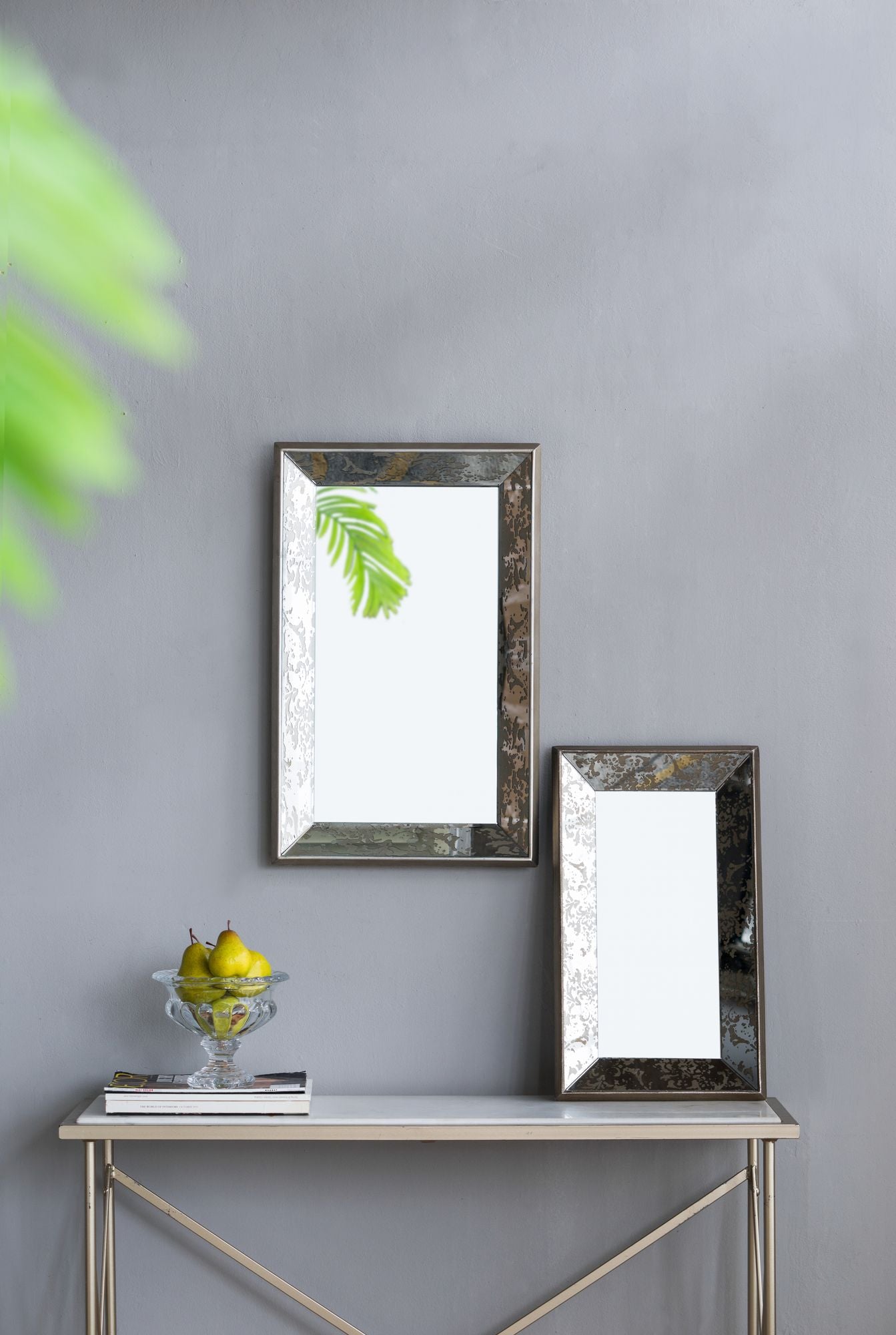 Mirror leaning against wall with tray display