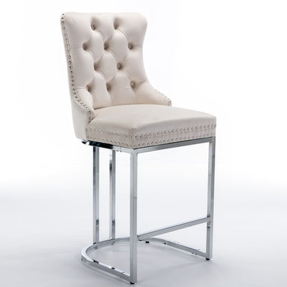 Close-up of button tufted backrest on beige velvet bar stool