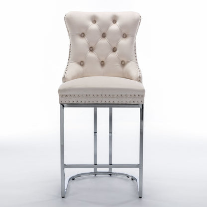 Beige velvet bar stool with chrome base and rivet trim - side angle