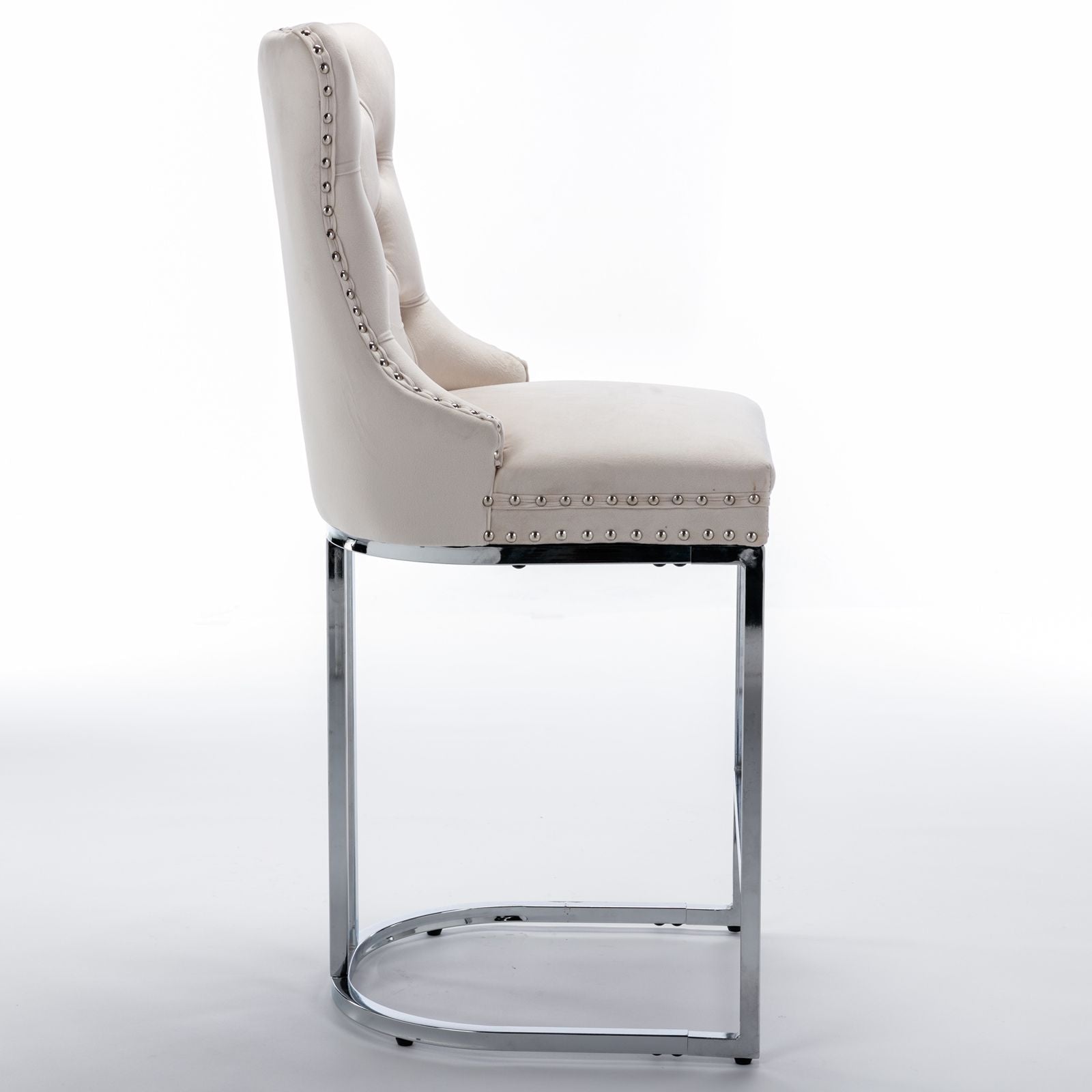 Pair of beige velvet bar stools placed at kitchen island