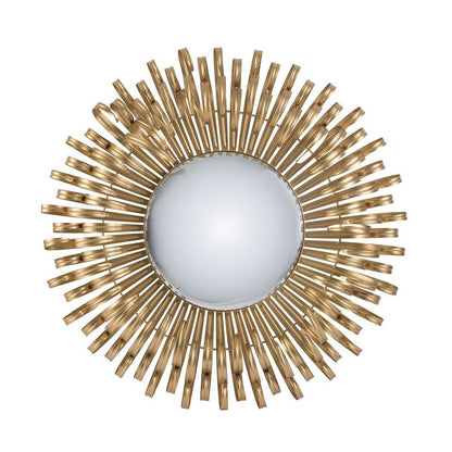 Decorative golden sunburst mirror on wall