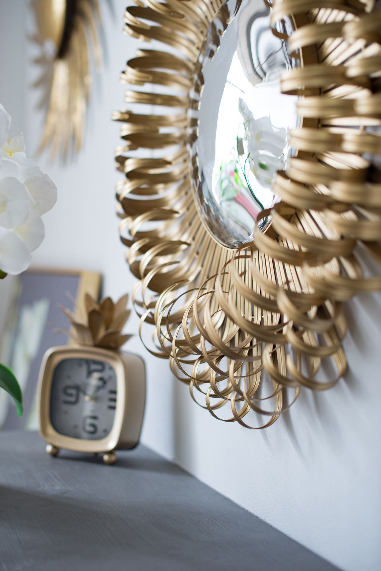 Sunburst wall mirror in entryway decor