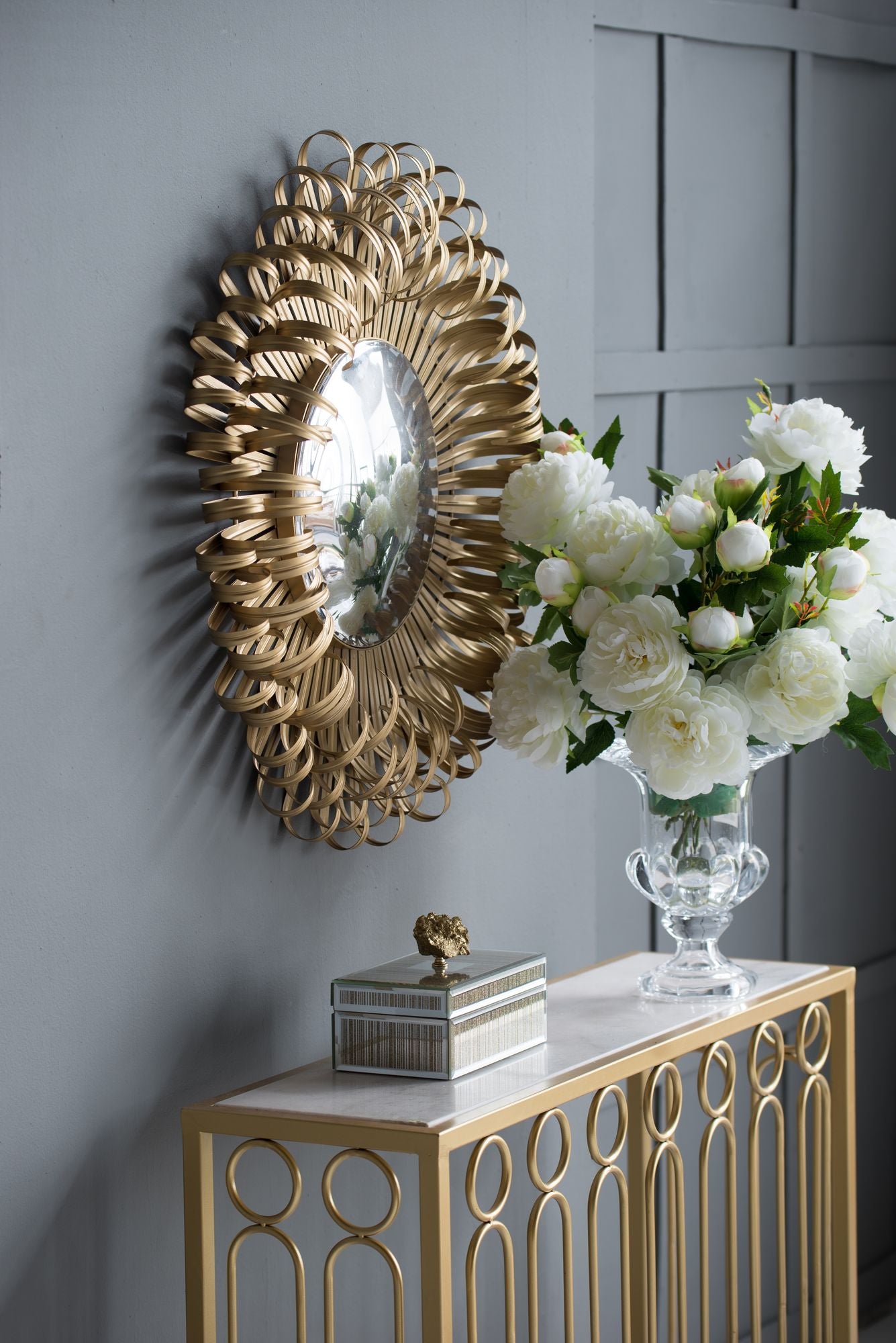 Close up of sunburst mirror golden finish