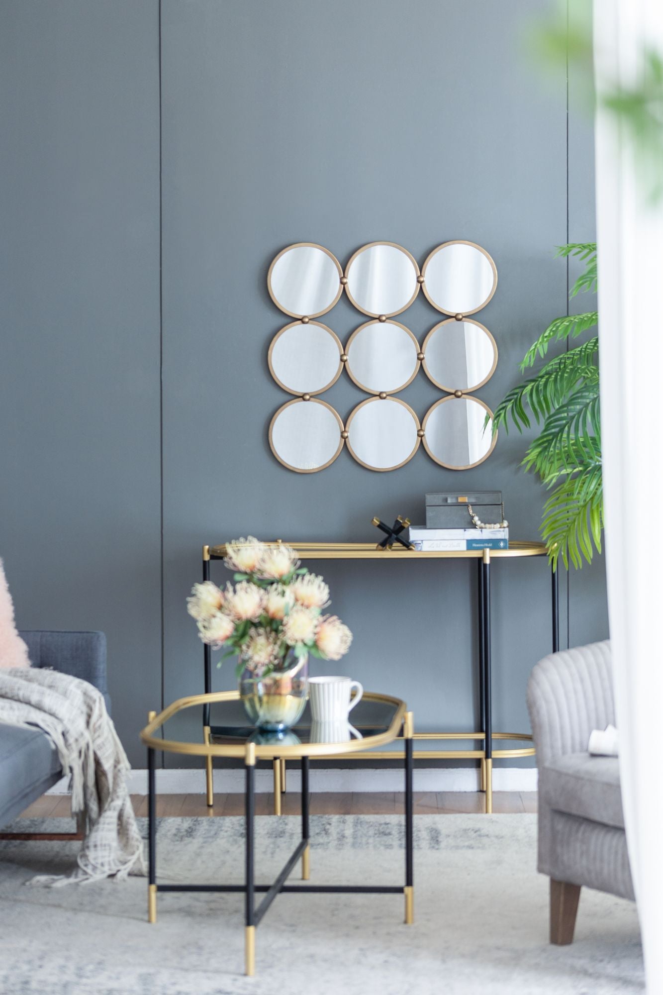 Contemporary decorative mirror hanging on wall in living room setting