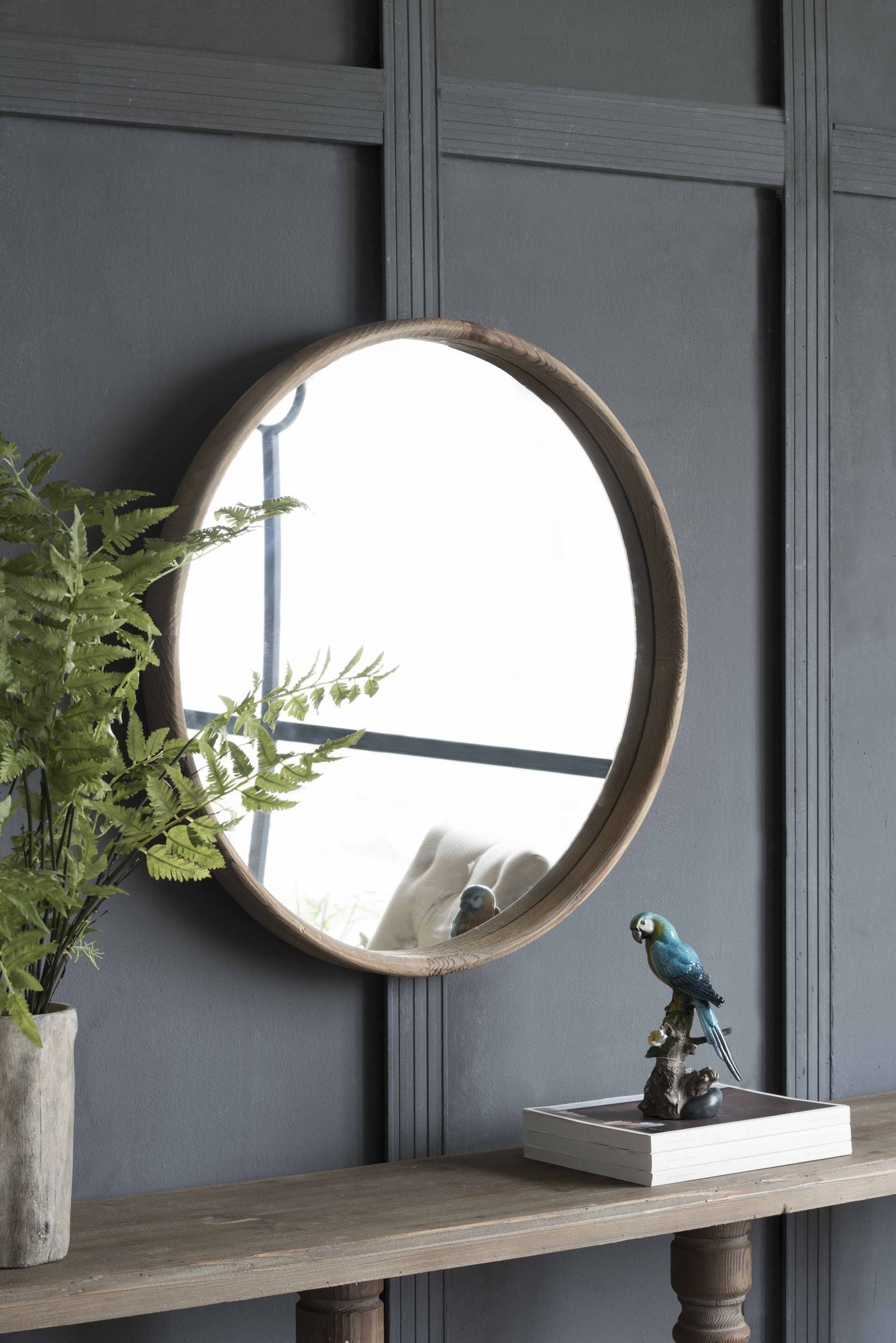 Close up of fir wood frame on round wall mirror