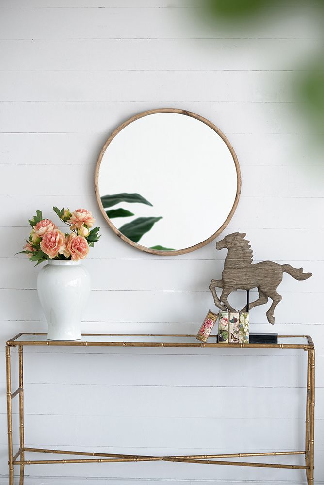 Side view of round wood mirror showing depth