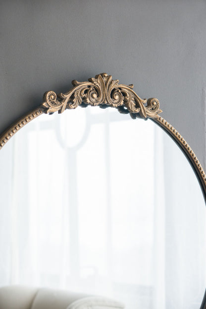Gold mirror on entryway console table
