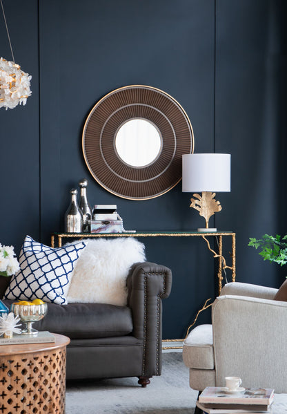 Round mirror with carved pleated pattern detail