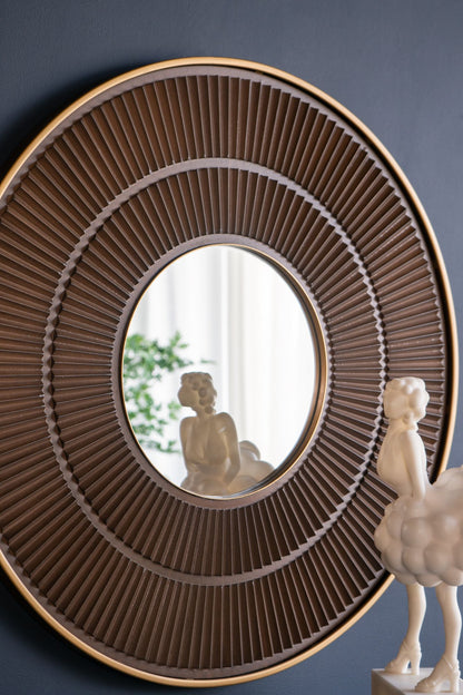 Mirror hanging on wall with neutral decor