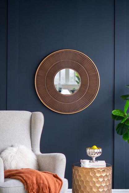 Round Carter wooden mirror with gold iron frame - angled view