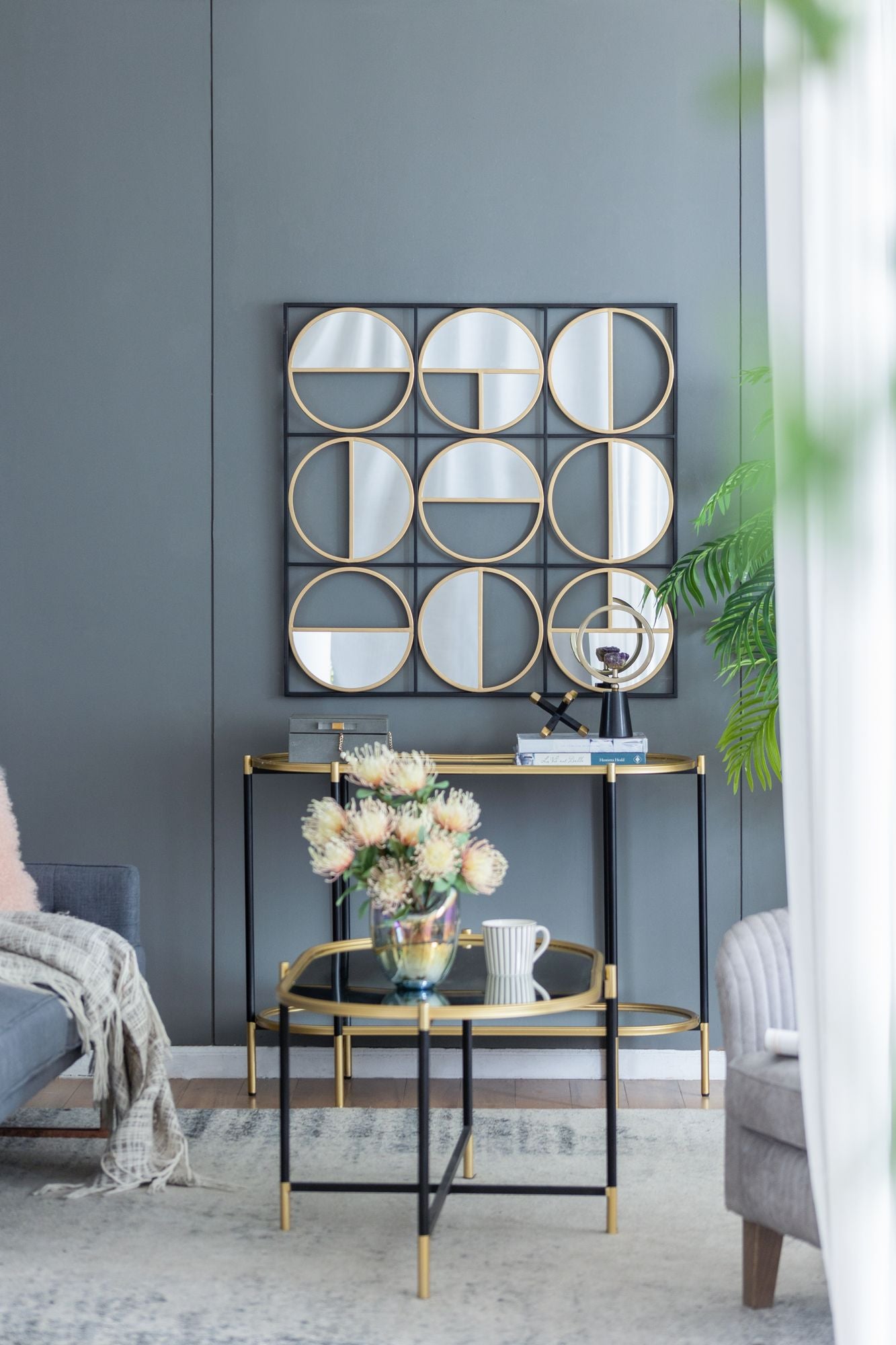 Close-up of metal beaded frame on black wall mirror