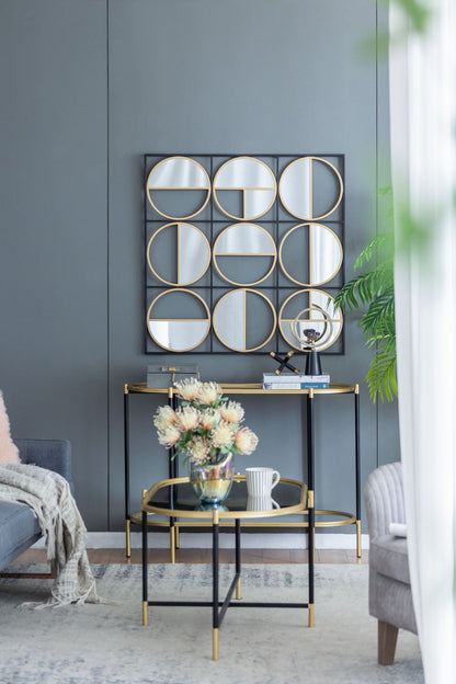 Close-up of metal beaded frame on black wall mirror