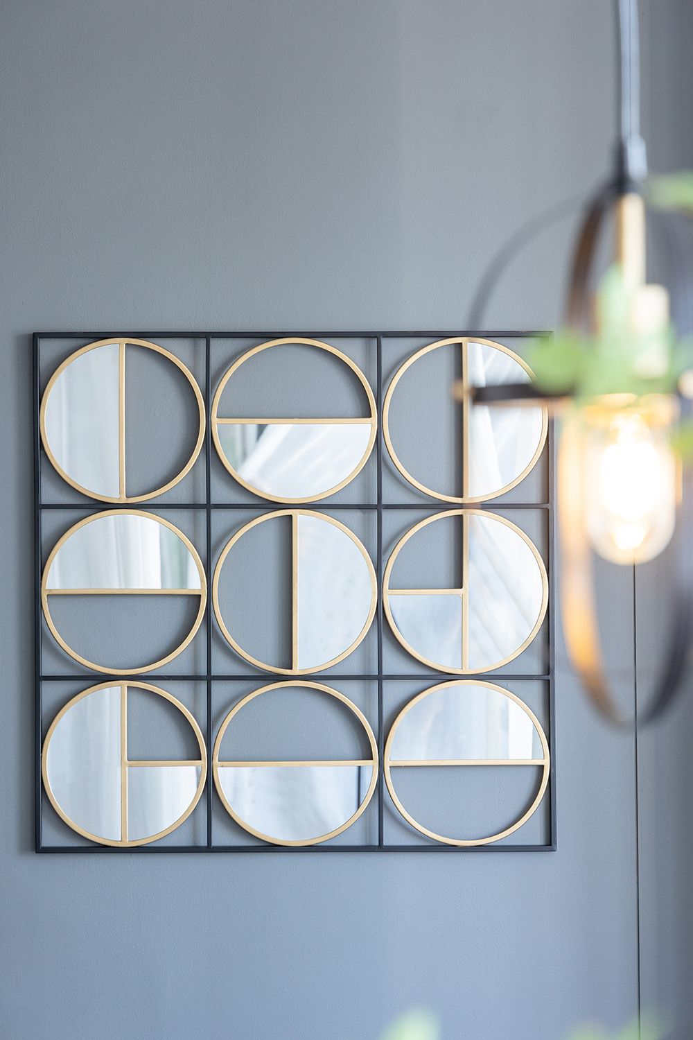 Rectangular black mirror with metal beads detail