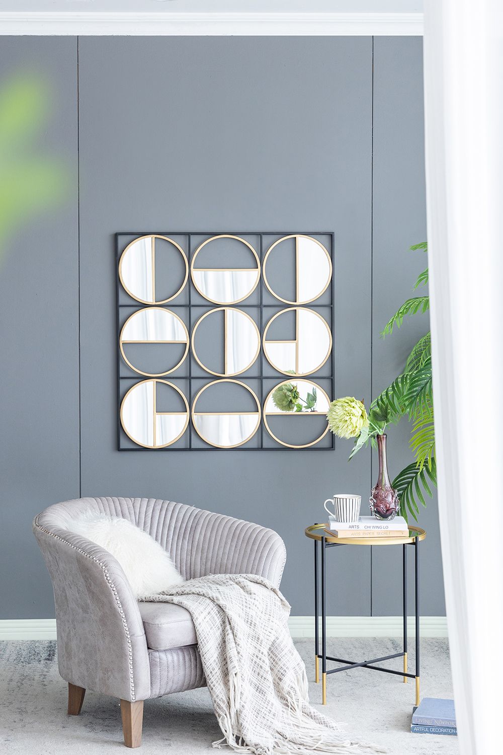 Black mirror with textured metal frame