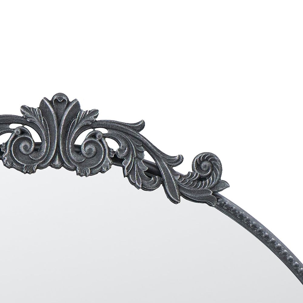 36x39 round baroque mirror black leaning against wall