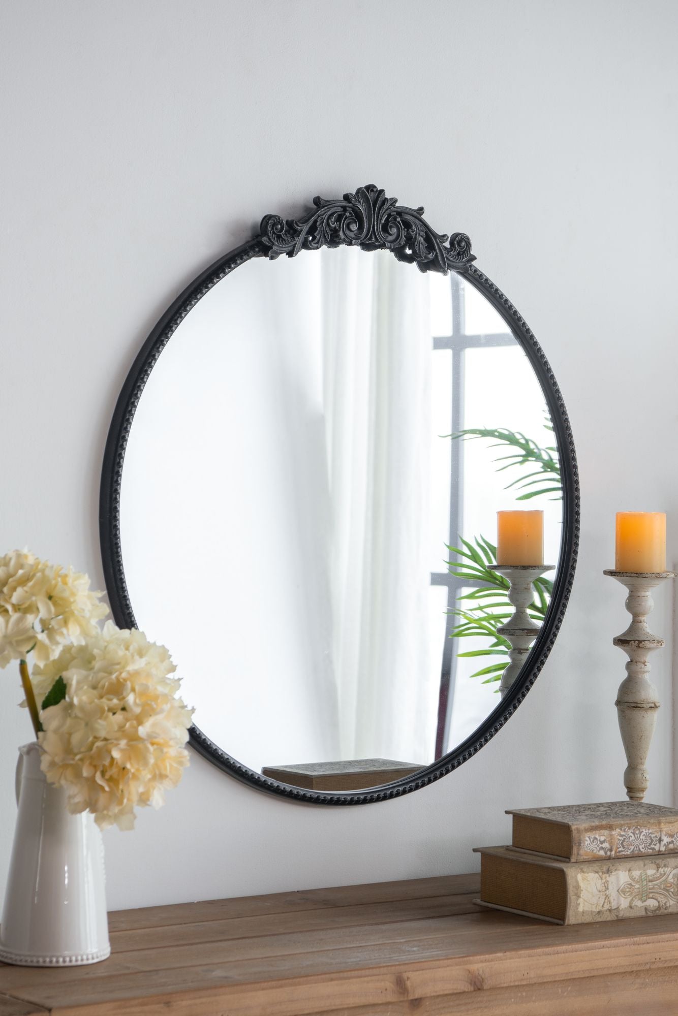 36x39 round baroque mirror black in bathroom setting