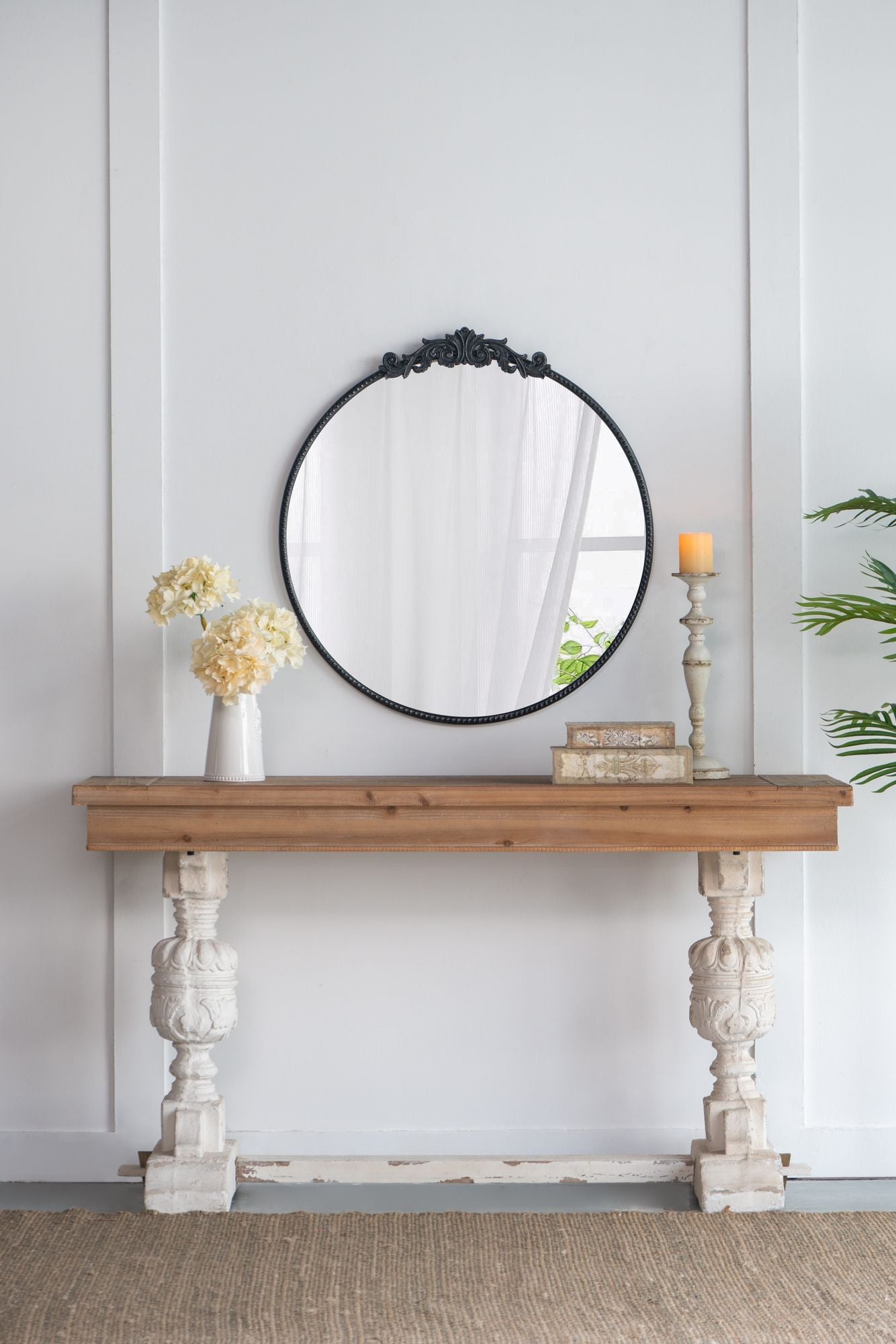 36x39 round baroque mirror black on console table