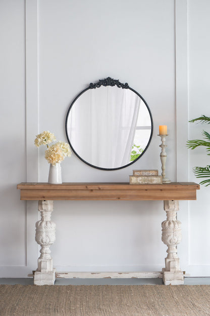 36x39 round baroque mirror black on console table