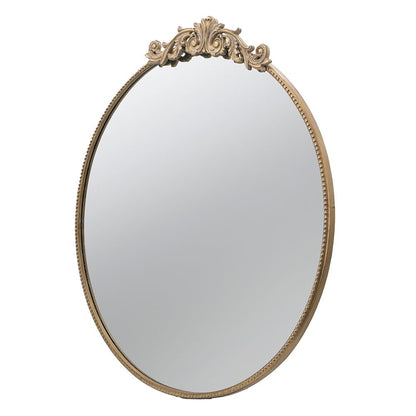 Gold framed round mirror for wall decoration - close up of frame detail