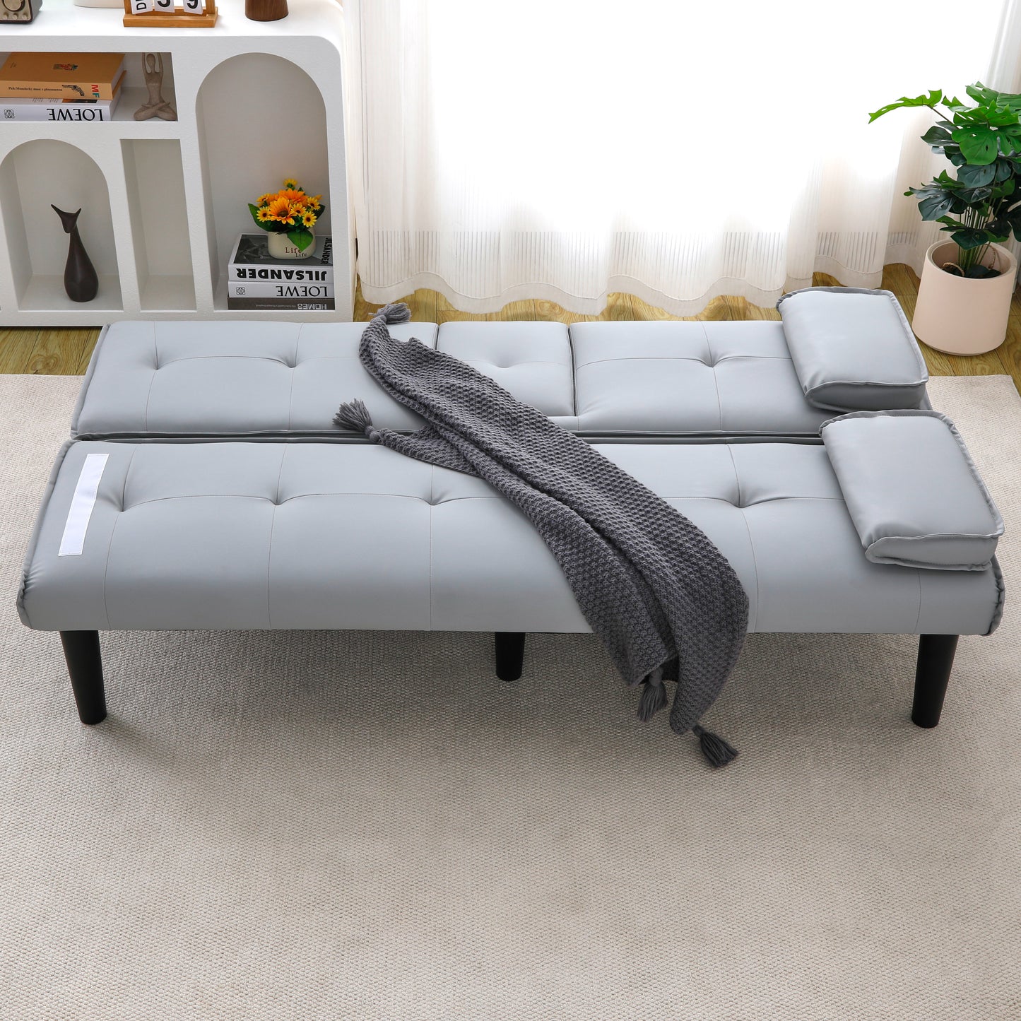 The 67-inch light gray PVC multi-functional sofa bed, with a foldable and cup holder design, makes it extremely convenient to turn the living room into a guest room image 2