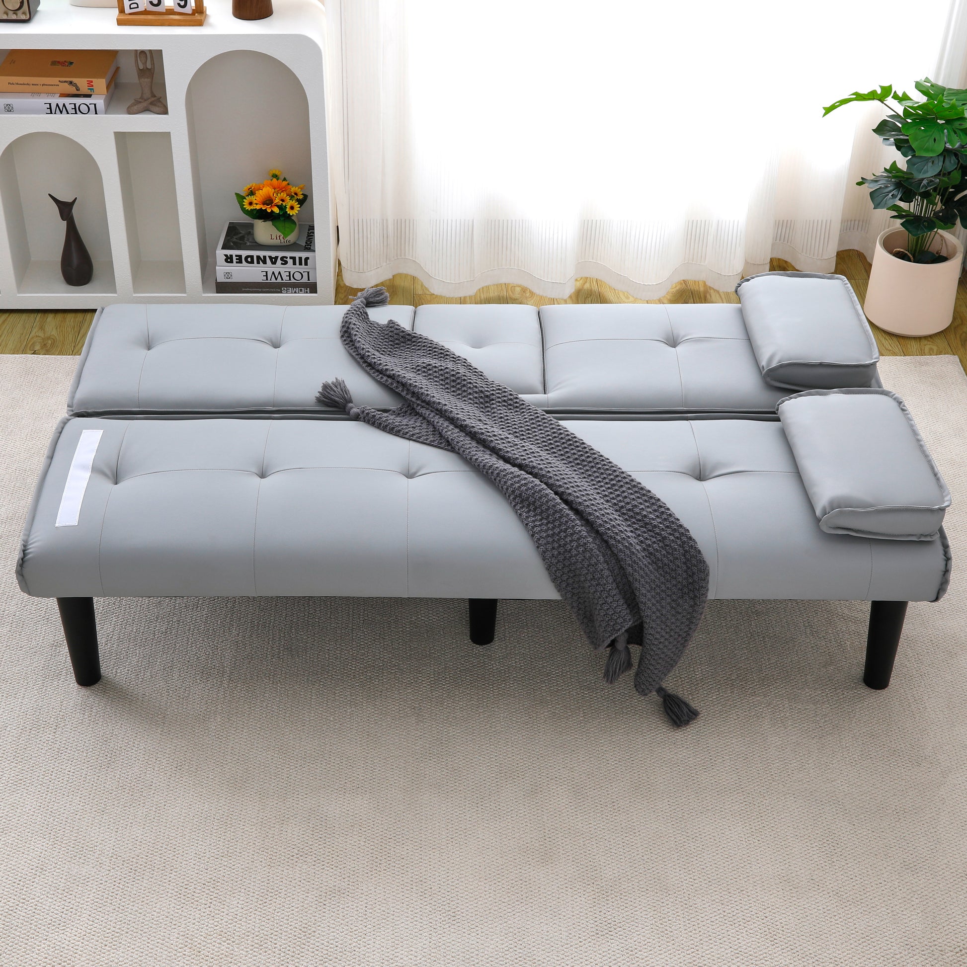 The 67-inch light gray PVC multi-functional sofa bed, with a foldable and cup holder design, makes it extremely convenient to turn the living room into a guest room image 2