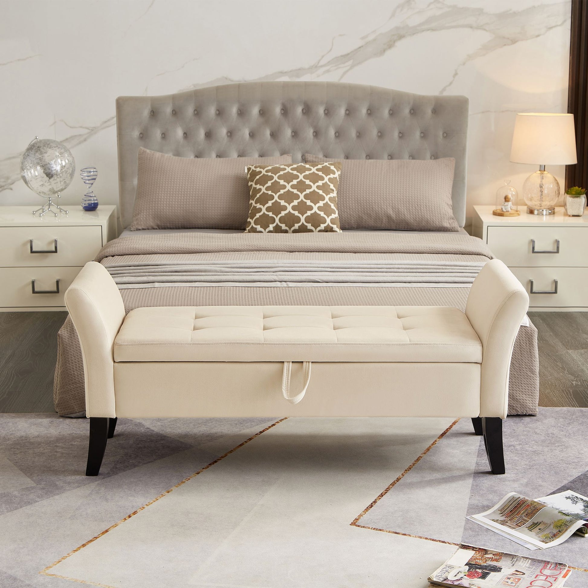 Beige velvet storage bench with tufted surface and curved arms