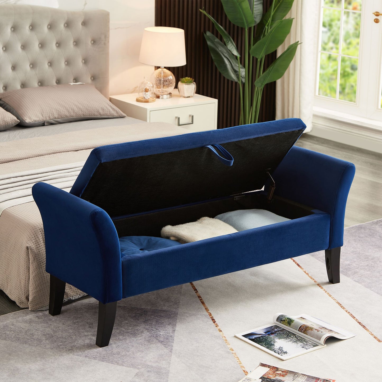 Navy blue velvet storage bench with storage compartment open showing interior