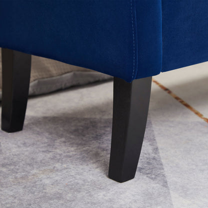 Navy blue tufted storage bench used as bed bench at foot of bed