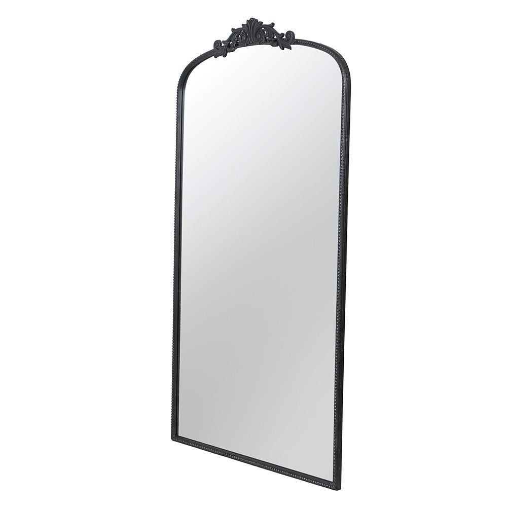 66 inch arched mirror leaning against wall in living room