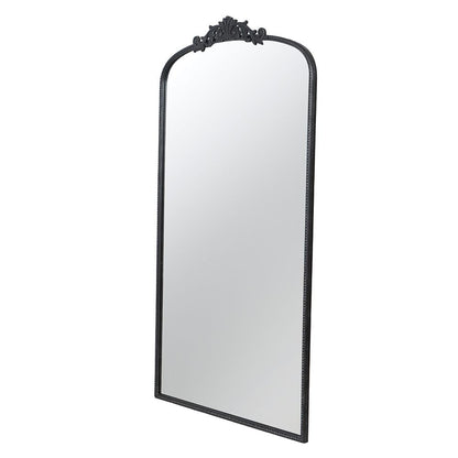 66 inch arched mirror leaning against wall in living room
