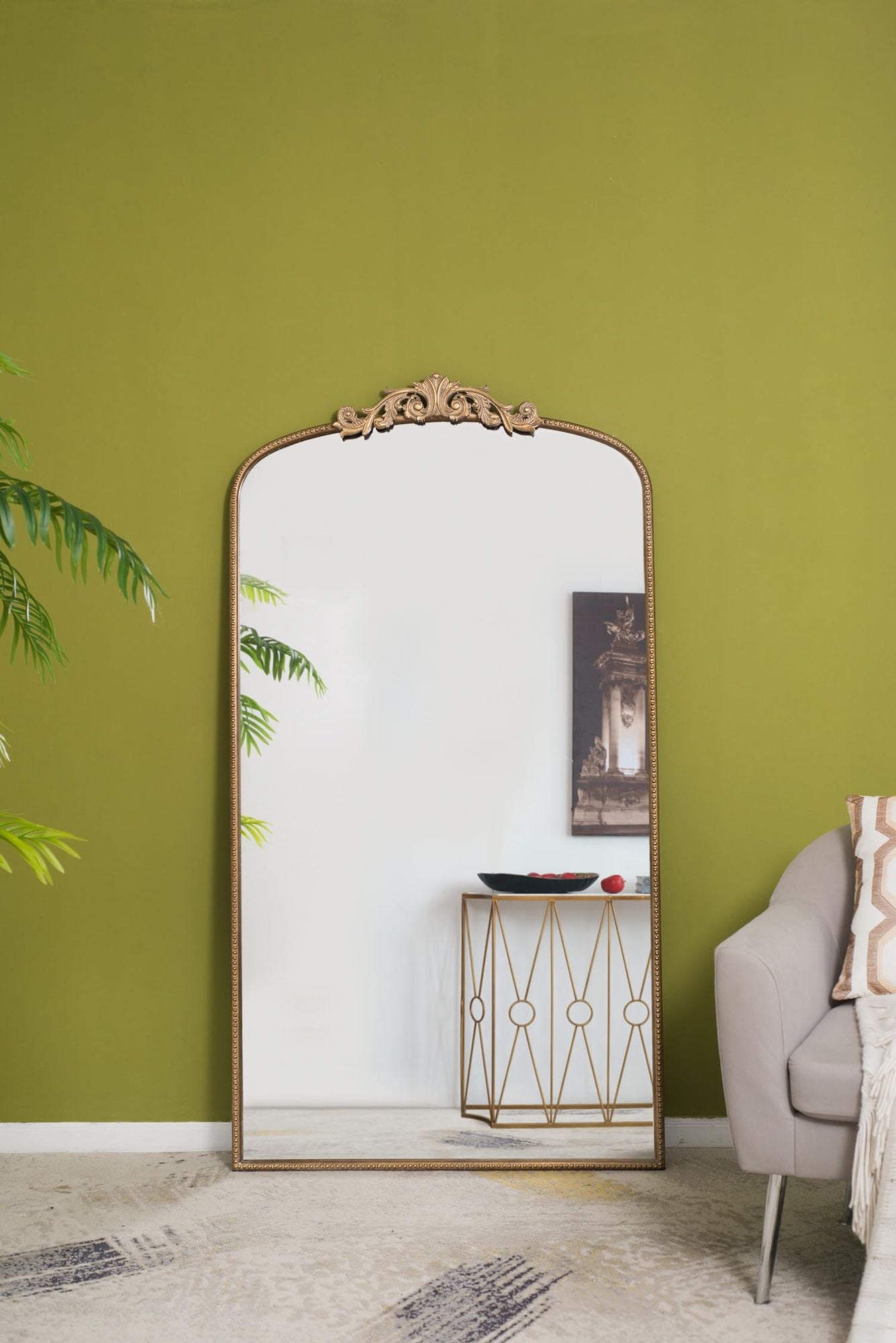 66x36 arched full length mirror gold frame hanging on wall in living room