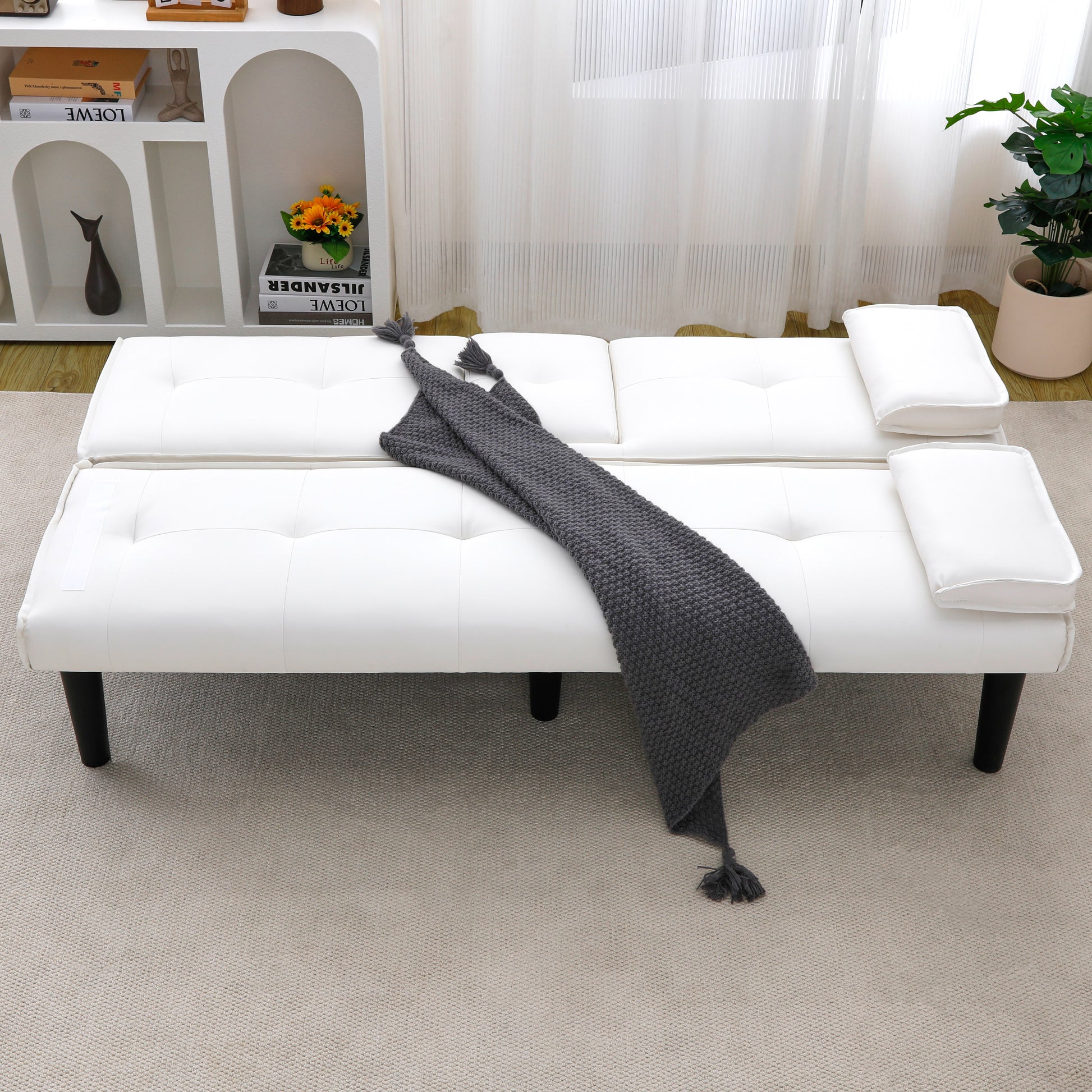 The 67-inch white PVC multi-functional sofa bed, with a foldable and cup holder design, makes it extremely convenient to turn the living room into a guest room image 3