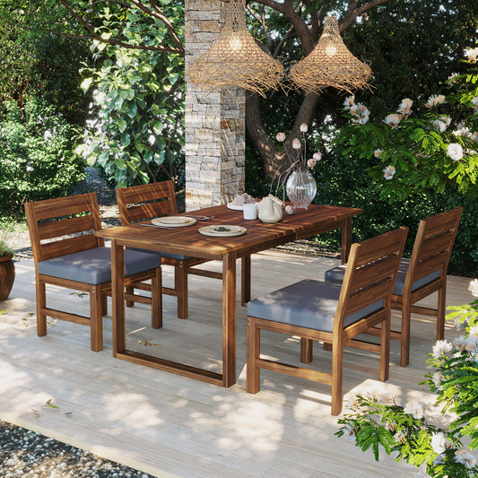 Farmhouse outdoor patio dining set with acacia wood table and four chairs on deck