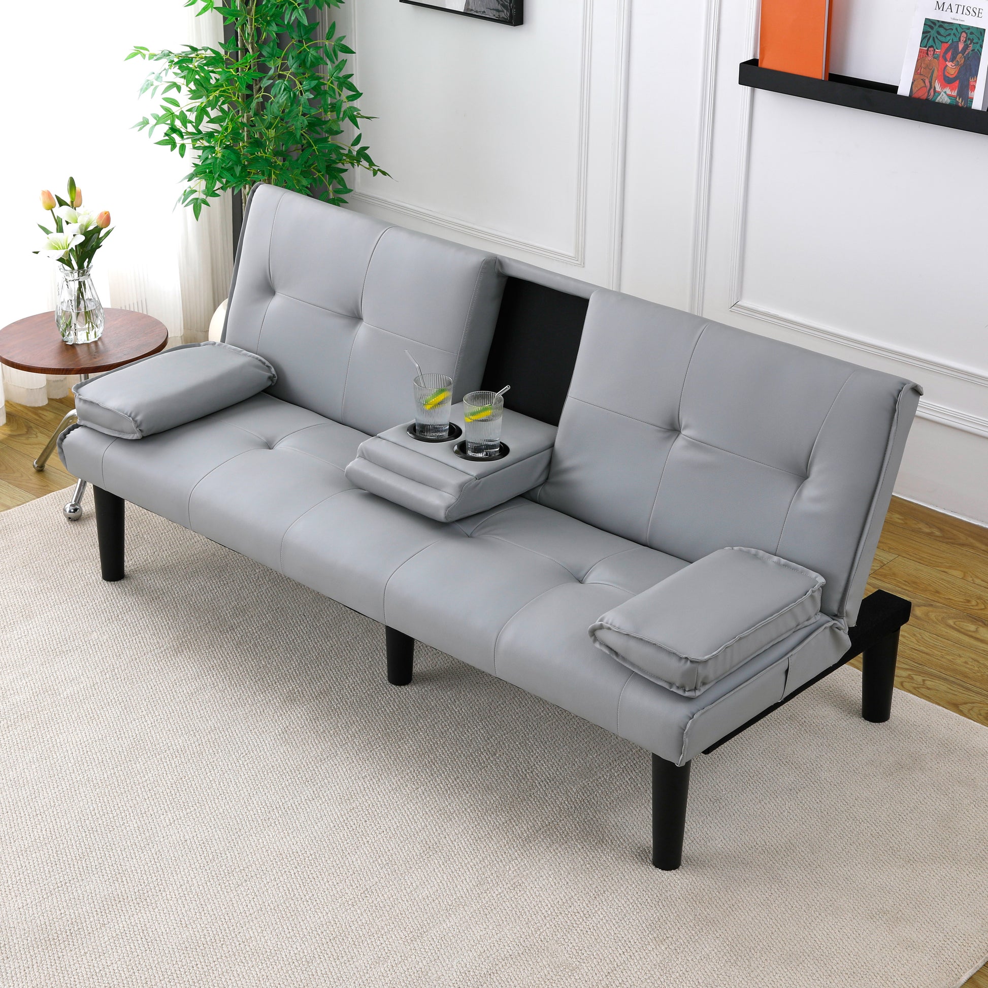 The 67-inch light gray PVC multi-functional sofa bed, with a foldable and cup holder design, makes it extremely convenient to turn the living room into a guest room image 1