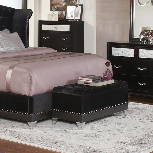 Black Tufted Trunk with Nailhead Trim – front view showing tufted top and metallic legs