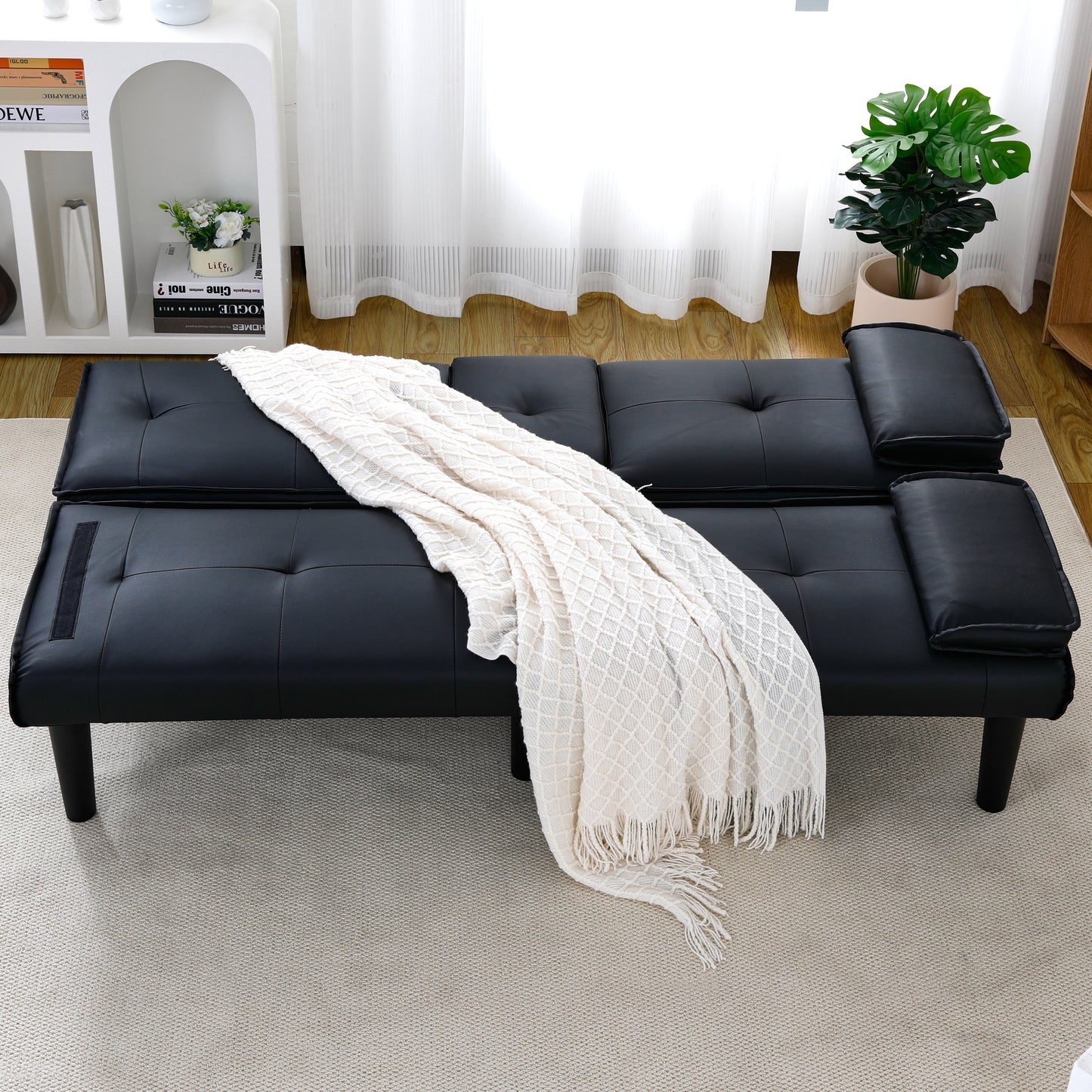 The 67-inch black PVC multi-functional sofa bed with a foldable and cup holder design makes it extremely convenient to turn the living room into a guest room image 2
