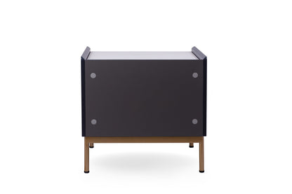 Modern end table in living room setting with gold accents
