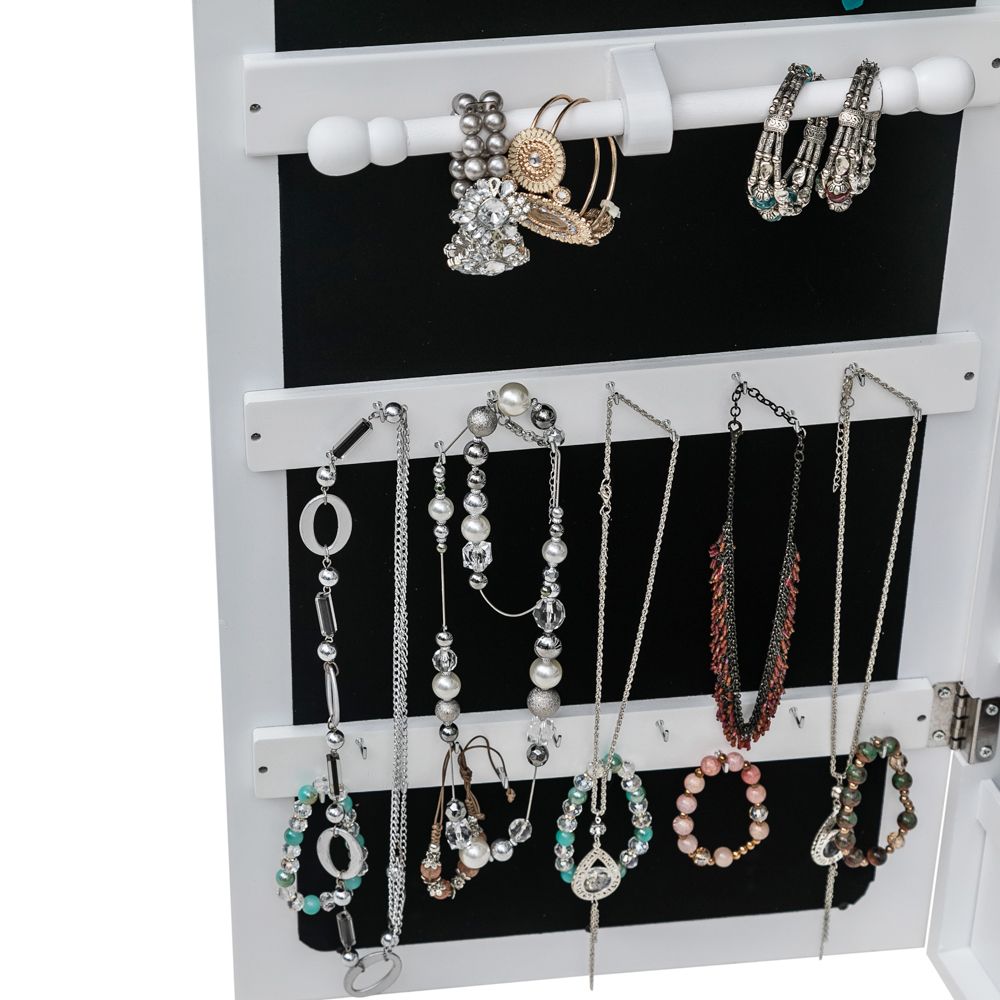 White jewelry cabinet with lock and key detail