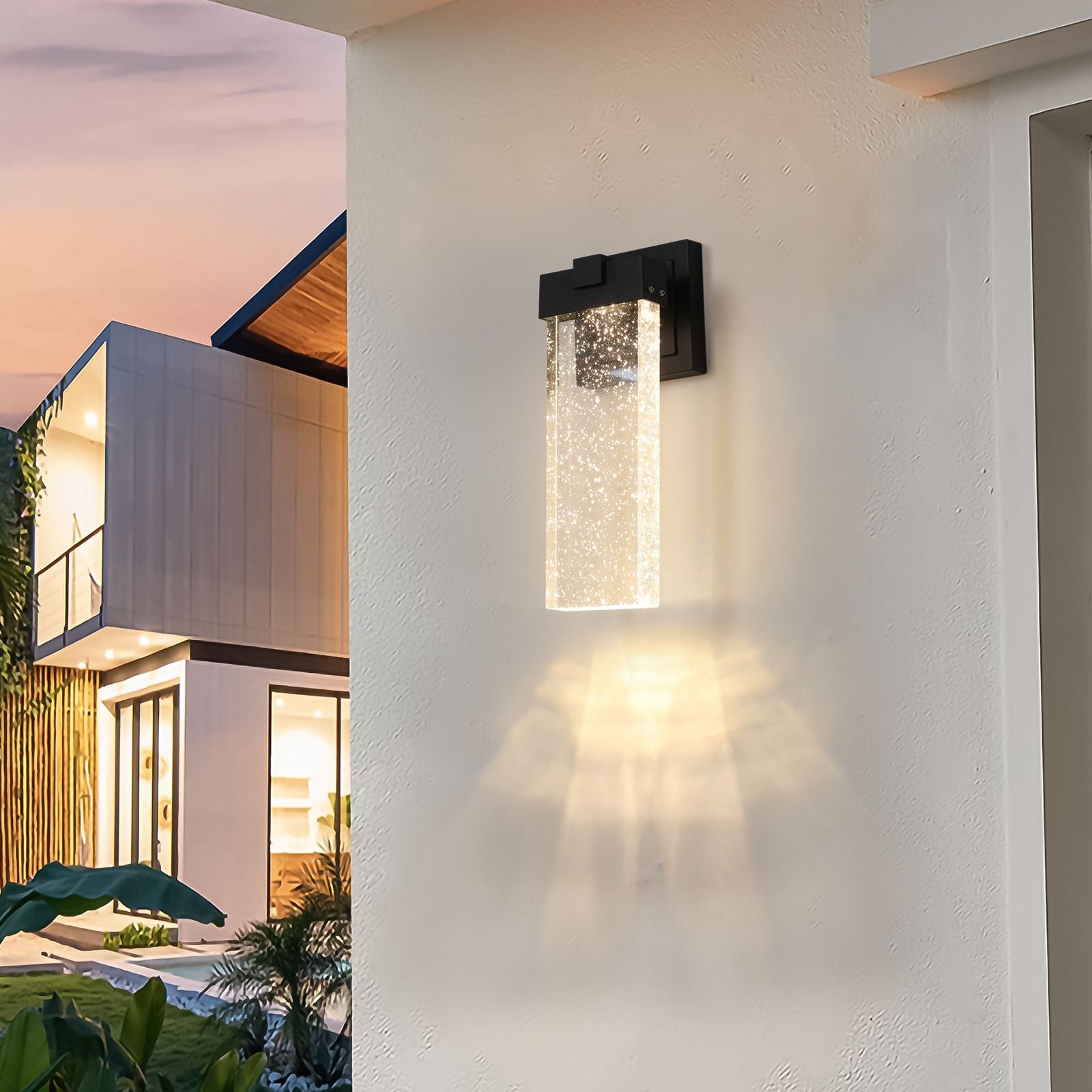 Outdoor crystal wall lamp installed on porch with warm light
