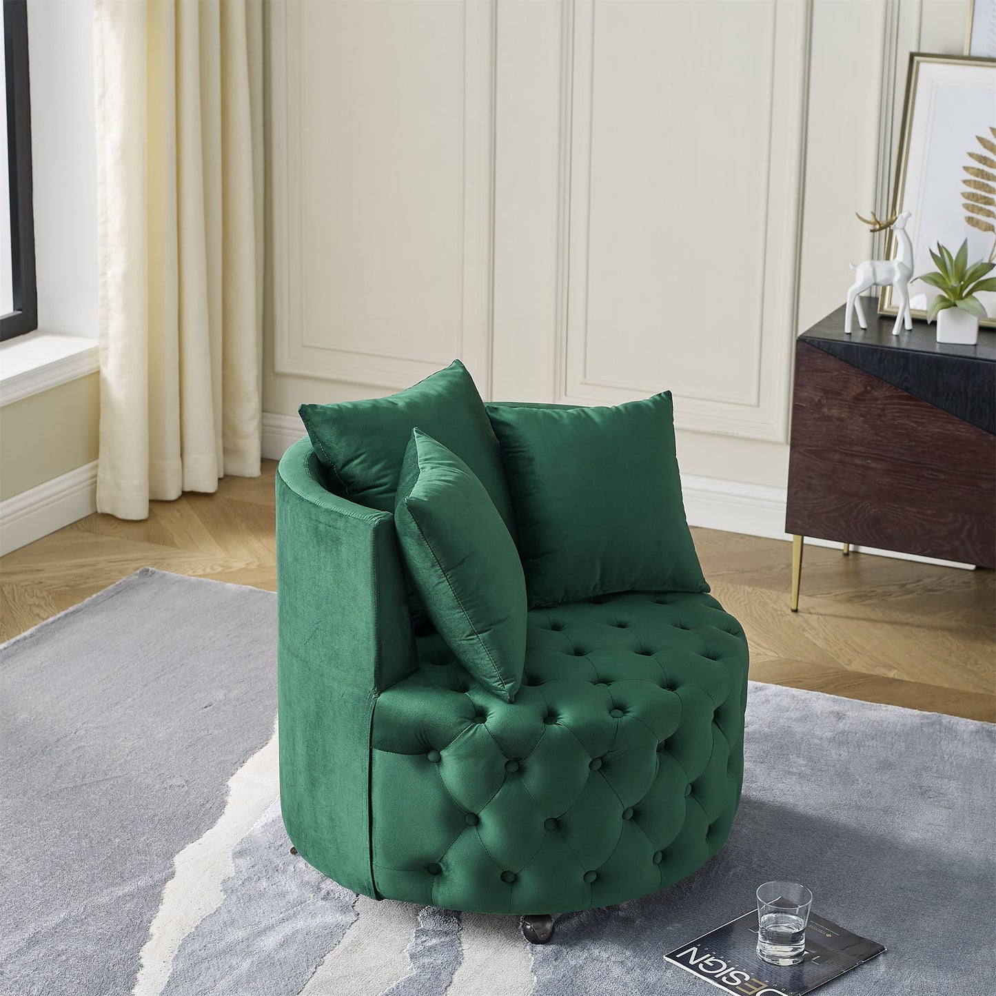 Swivel chair with movable wheels and three decorative pillows - living room setting